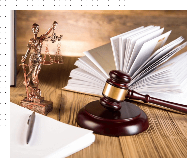 A gavel and a book on table