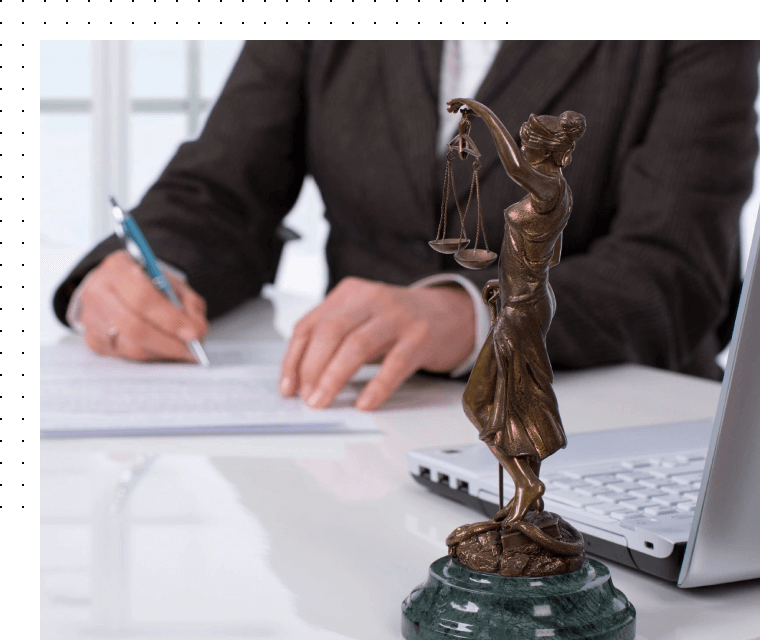 The statue of justice on lawyers table